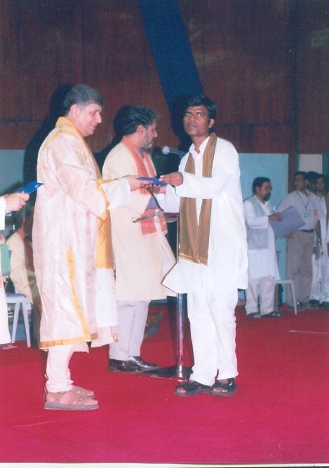 Pradeep Nagar receiving recognition at a college ceremony