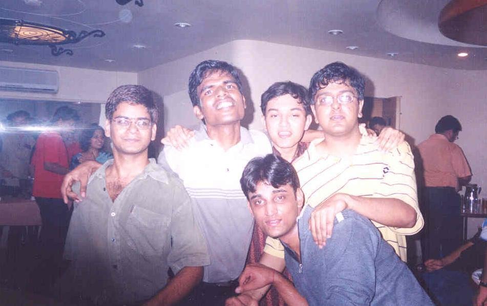 College friends gathered together indoors