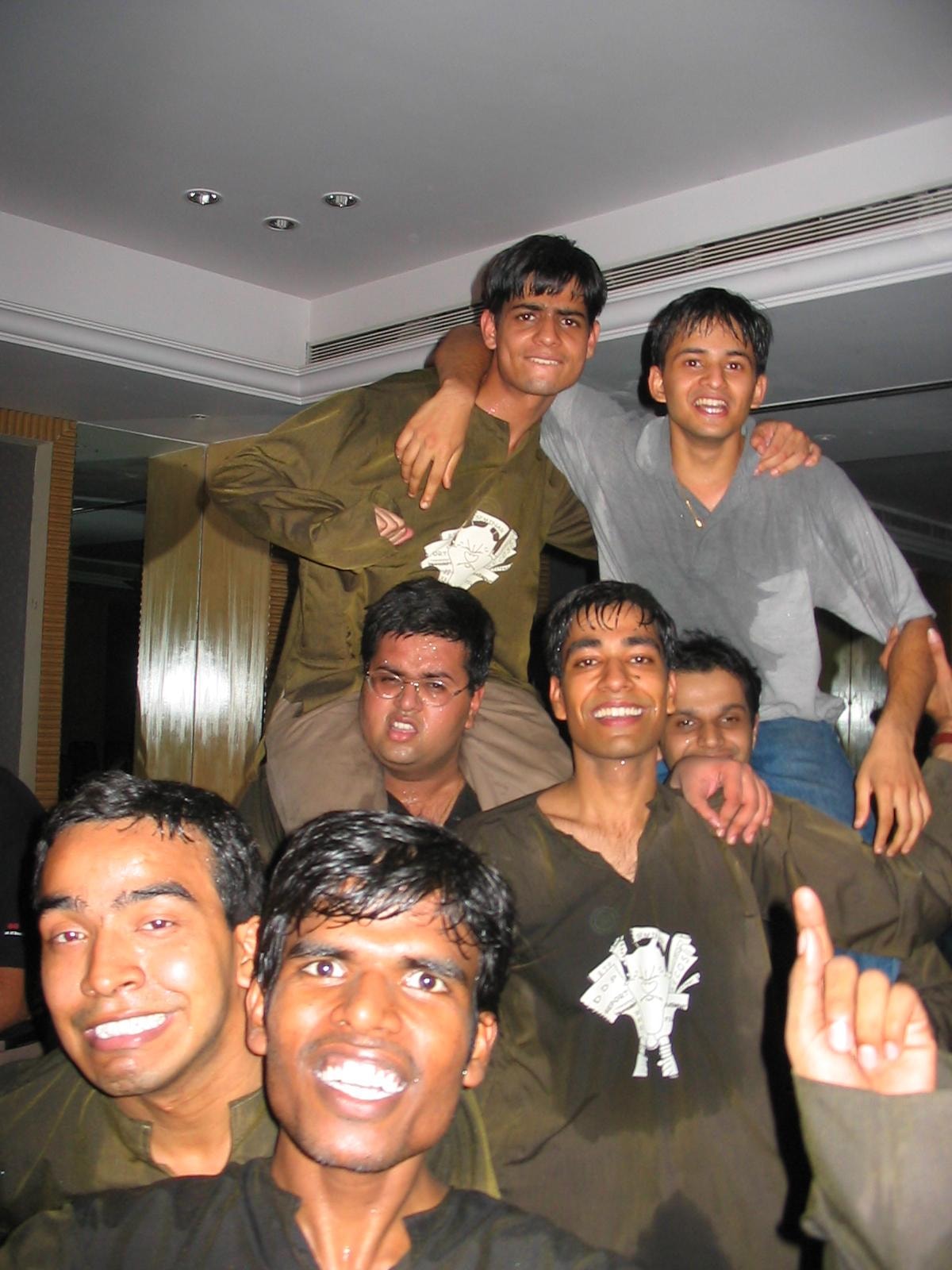 College friends celebrating together indoors