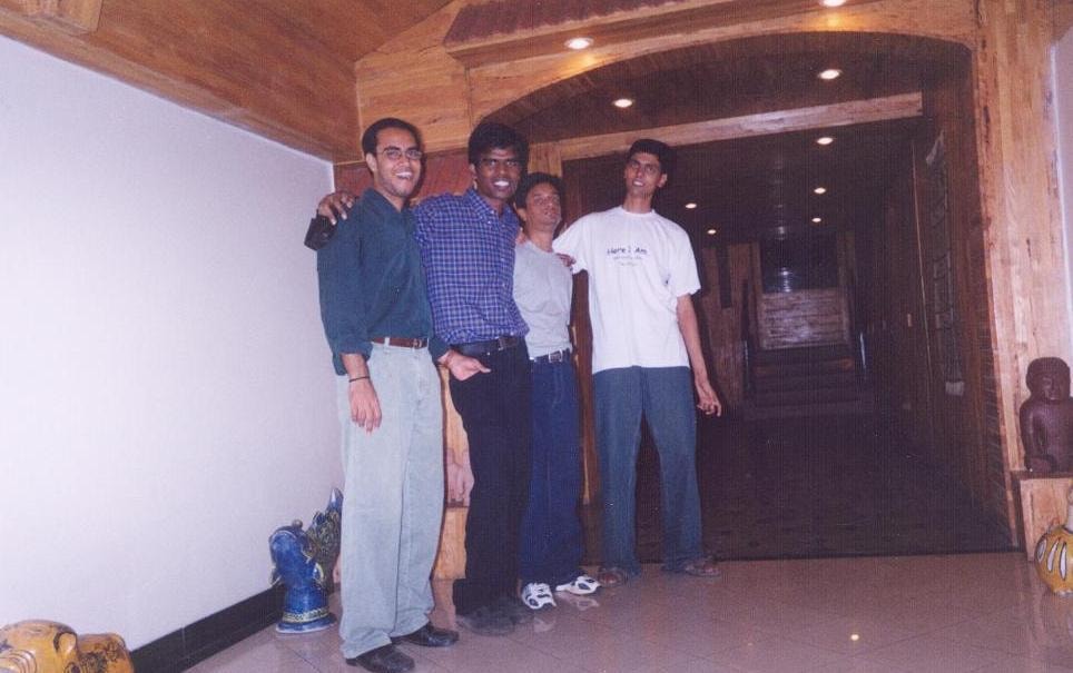 Four college friends together indoors