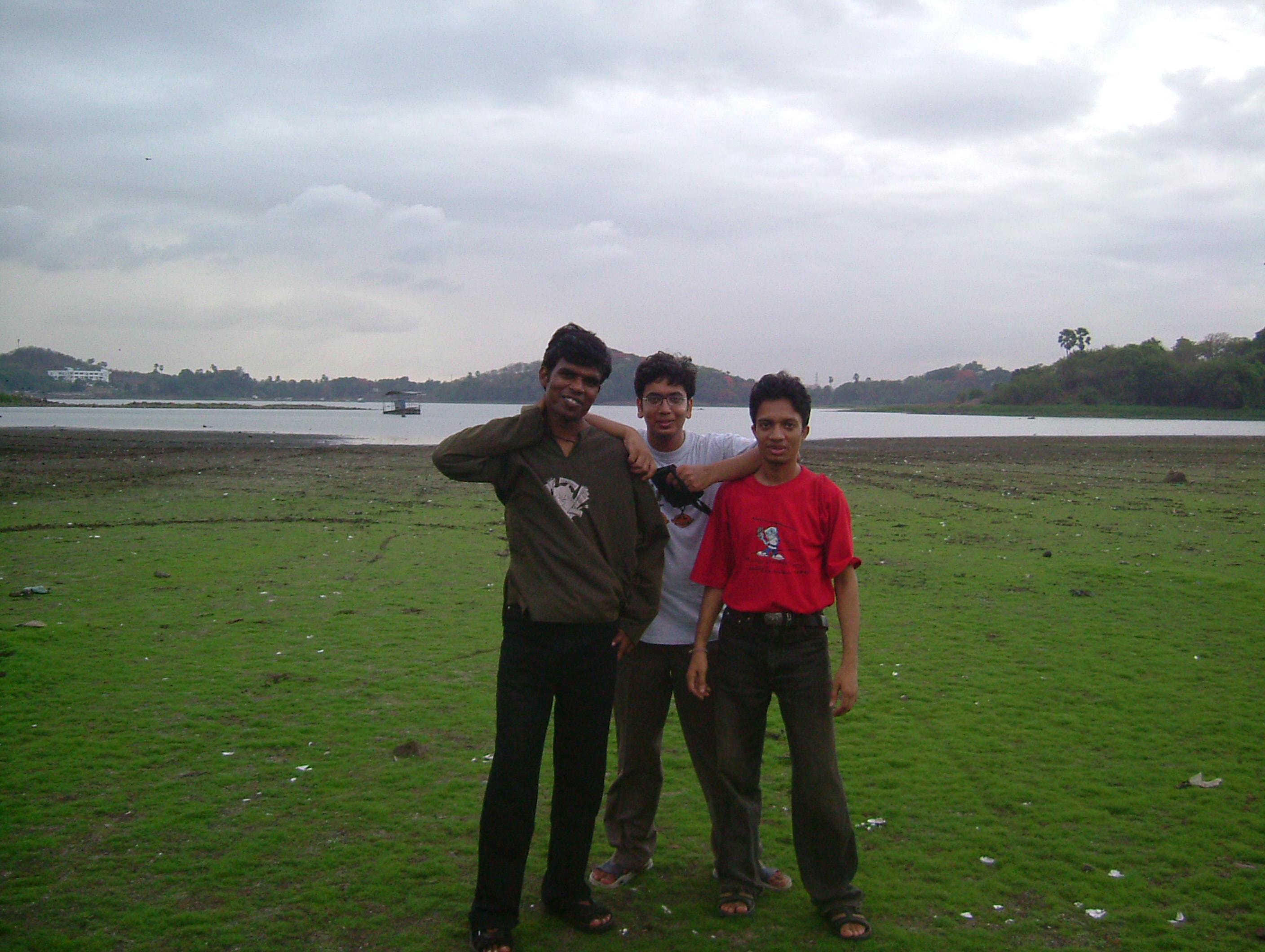 Three college friends together beside Powai Lake