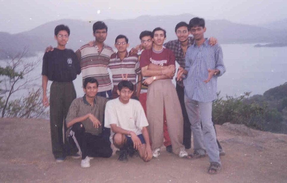 A group of college friends gathered outdoors at Sameer Hill
