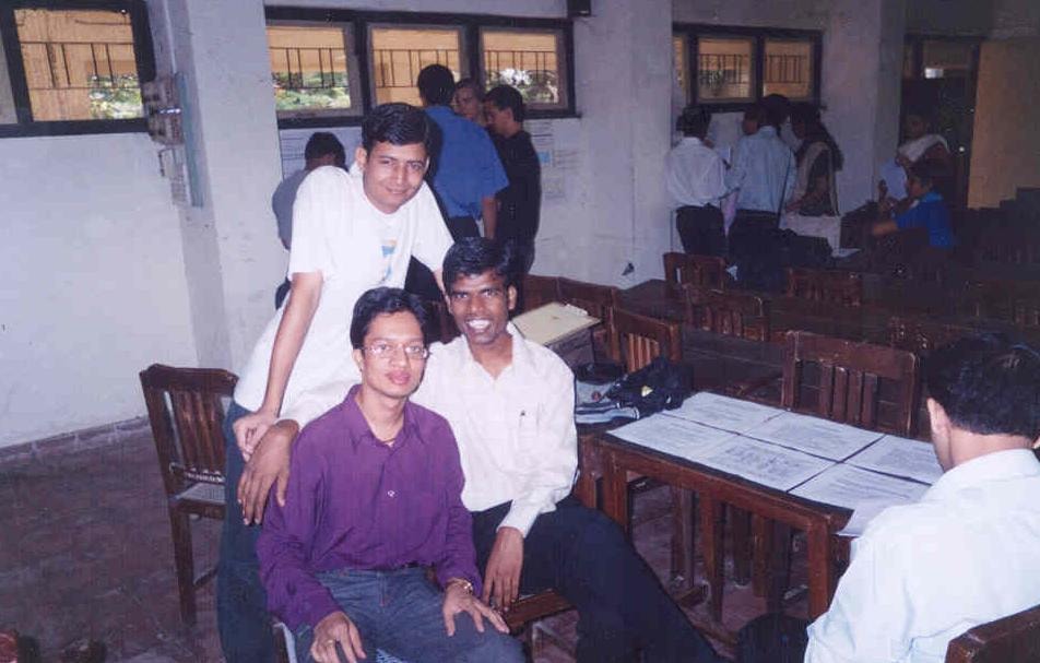 College friends gathered in a dining hall during a campus event