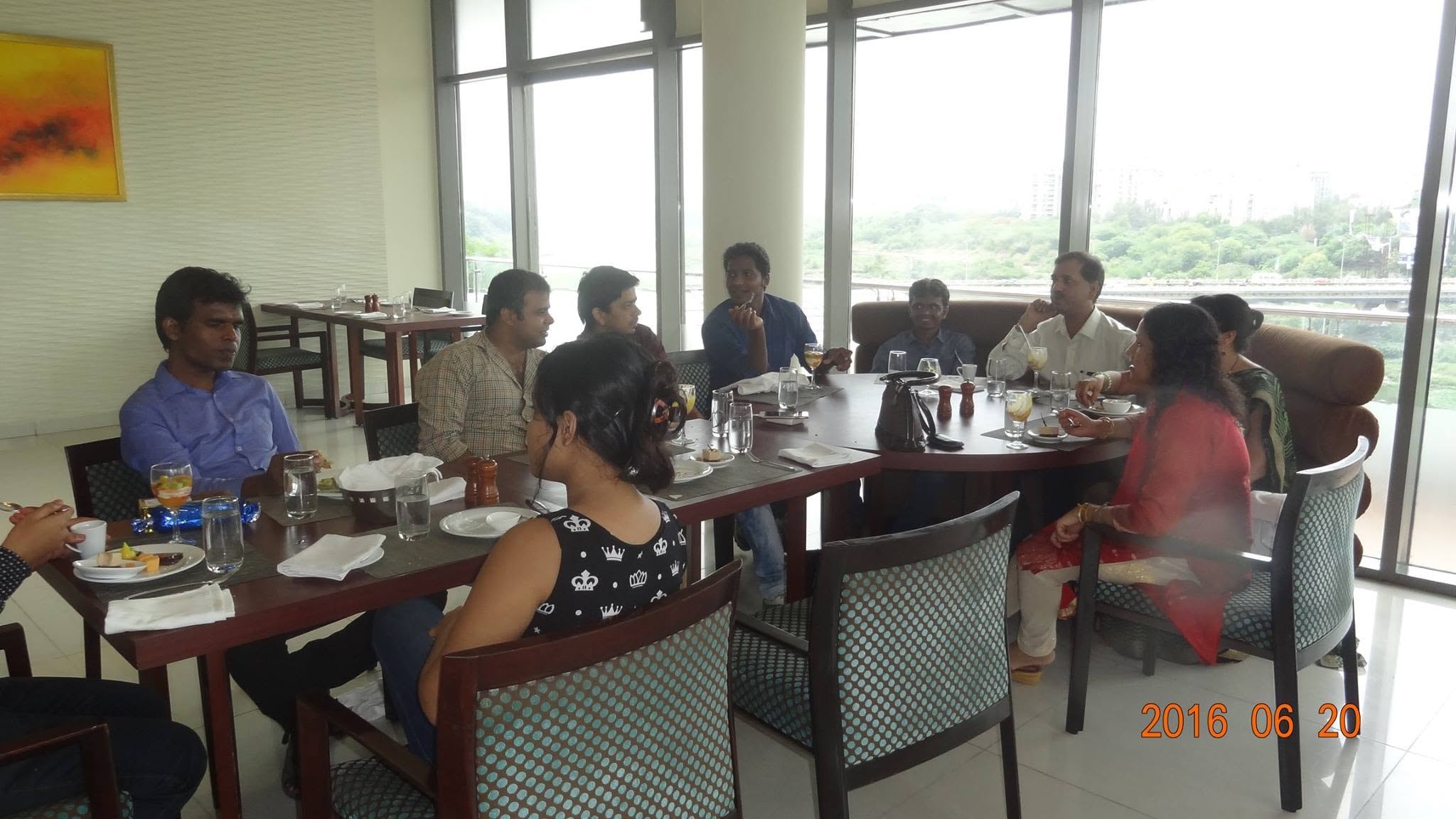 Friends sharing a meal and conversation at a restaurant