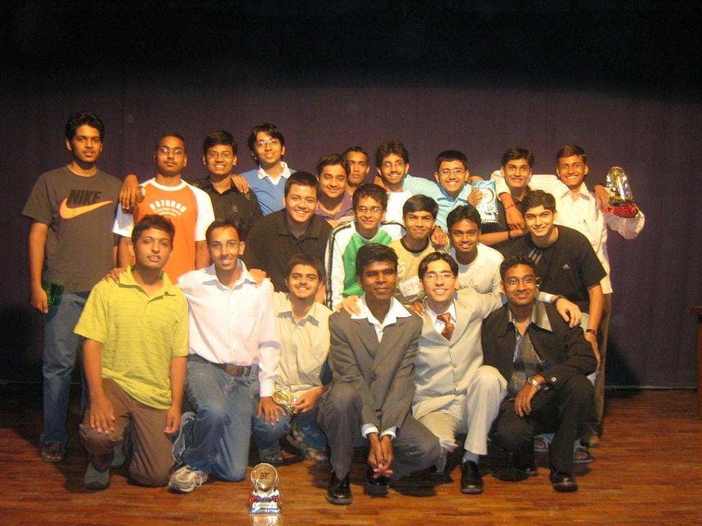 Bakliwal Tutorials IIT students celebrating with trophies at an award ceremony