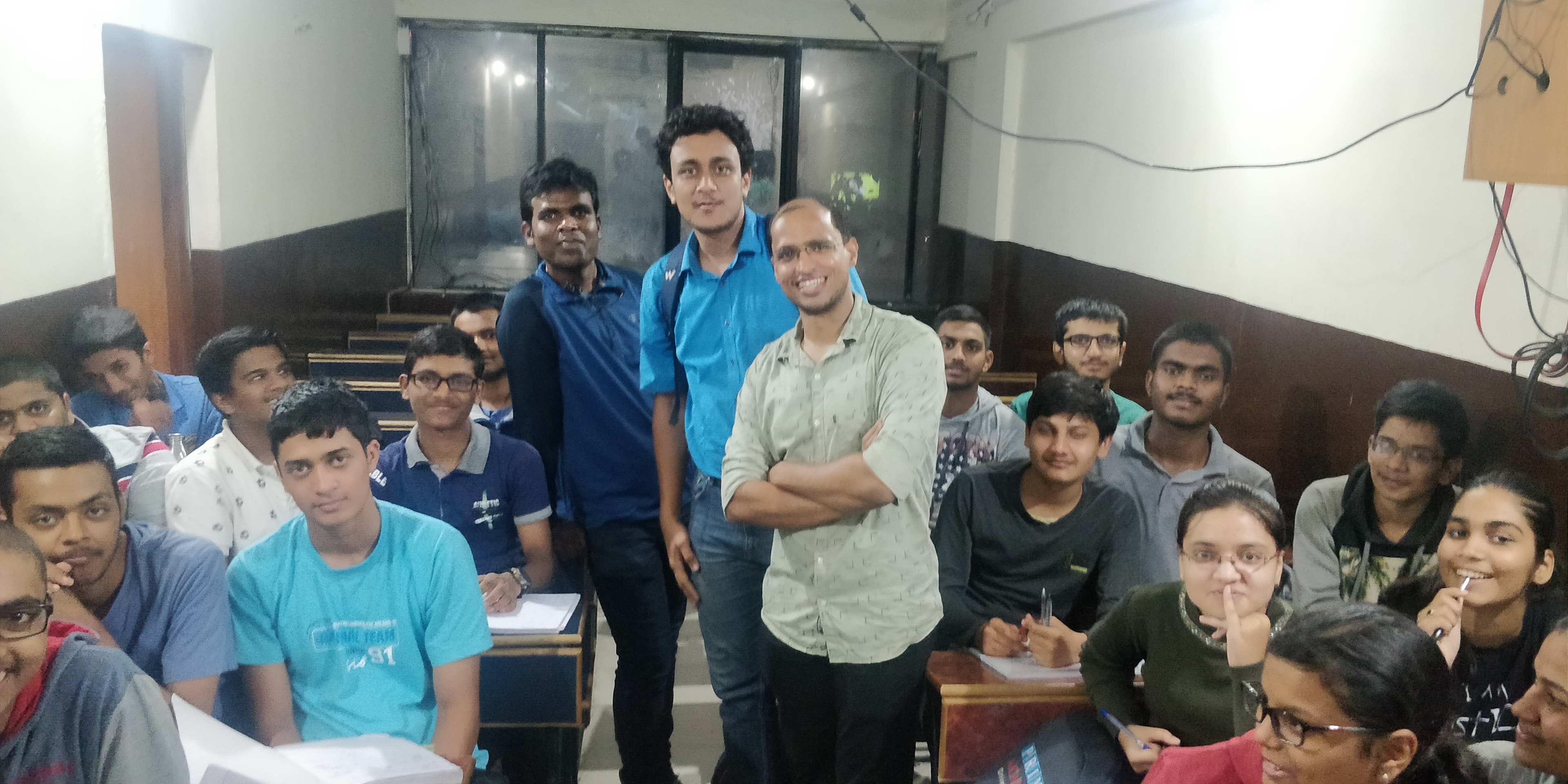 Students and mentors gathered in a classroom
