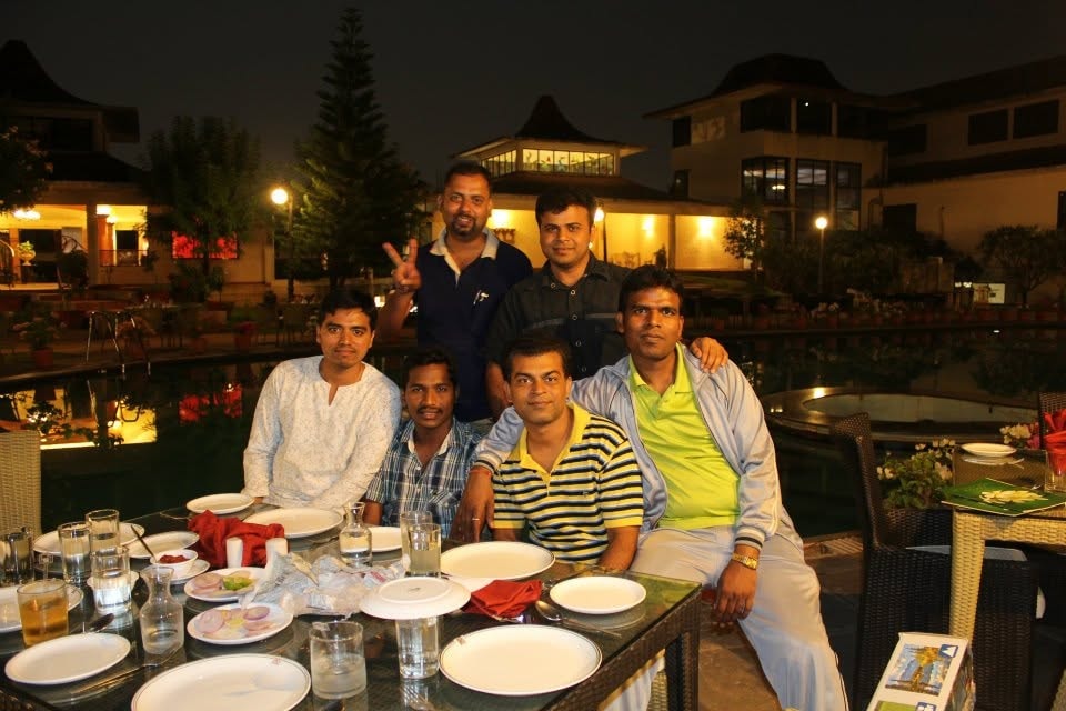 Friends gathered for dinner at an outdoor restaurant
