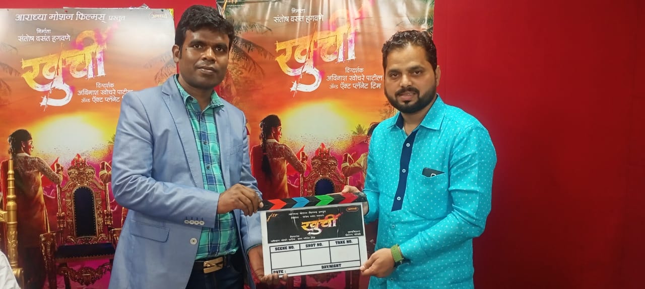 Pradeep Nagar with the helicopter ground crew on the Khurchi film set