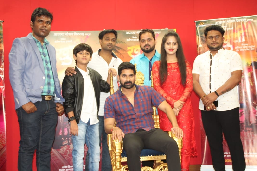 Pradeep Nagar and the Khurchi production team with the helicopter on set